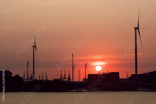 Sunset at a riverbank, Port of Antwerp, Belgium.