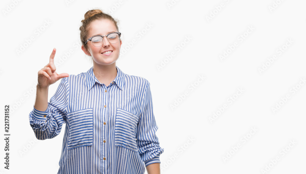 Young blonde business woman smiling and confident gesturing with hand doing size sign with fingers while looking and the camera. Measure concept. Young blonde business woman smiling and confident gesturing with hand doing size sign with fingers while looking and the camera. Measure concept.