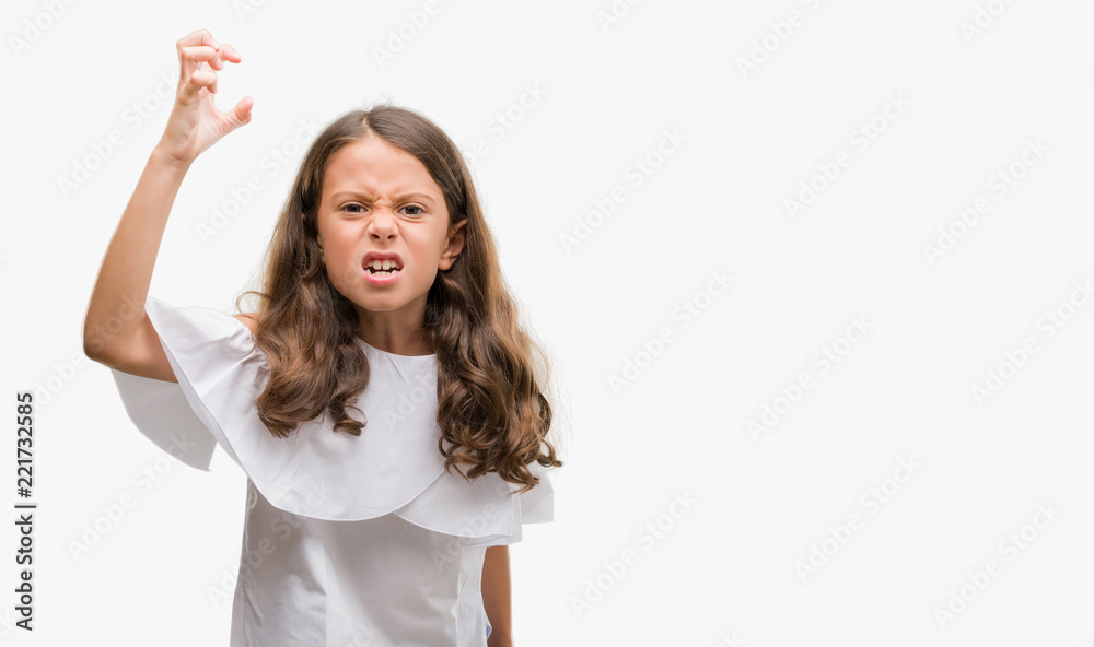 Brunette hispanic girl angry and mad raising fist frustrated and furious while shouting with anger. Rage and aggressive concept. Brunette hispanic girl angry and mad raising fist frustrated and furious while shouting with anger. Rage and aggressive concept.