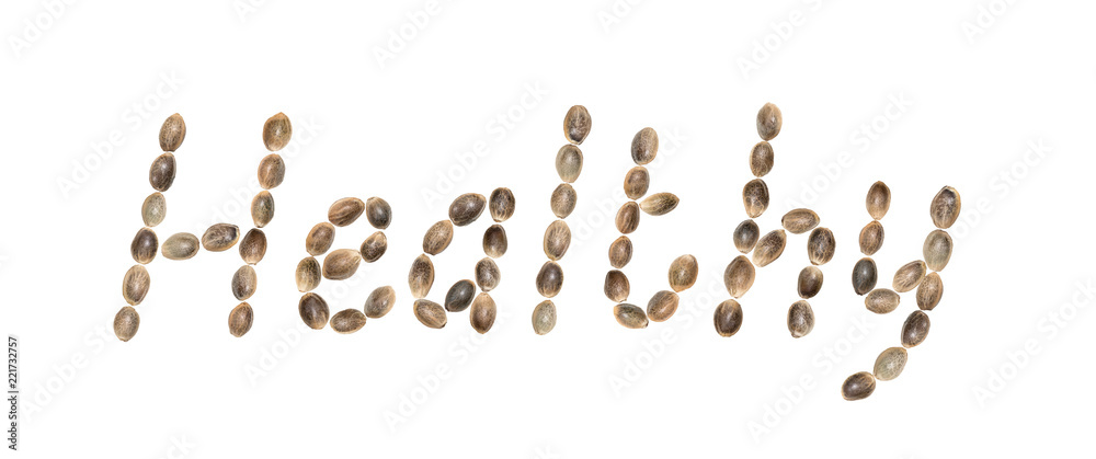 The word Healthy written using hemp seeds and isolated on white background The word Healthy written using hemp seeds and isolated on white background