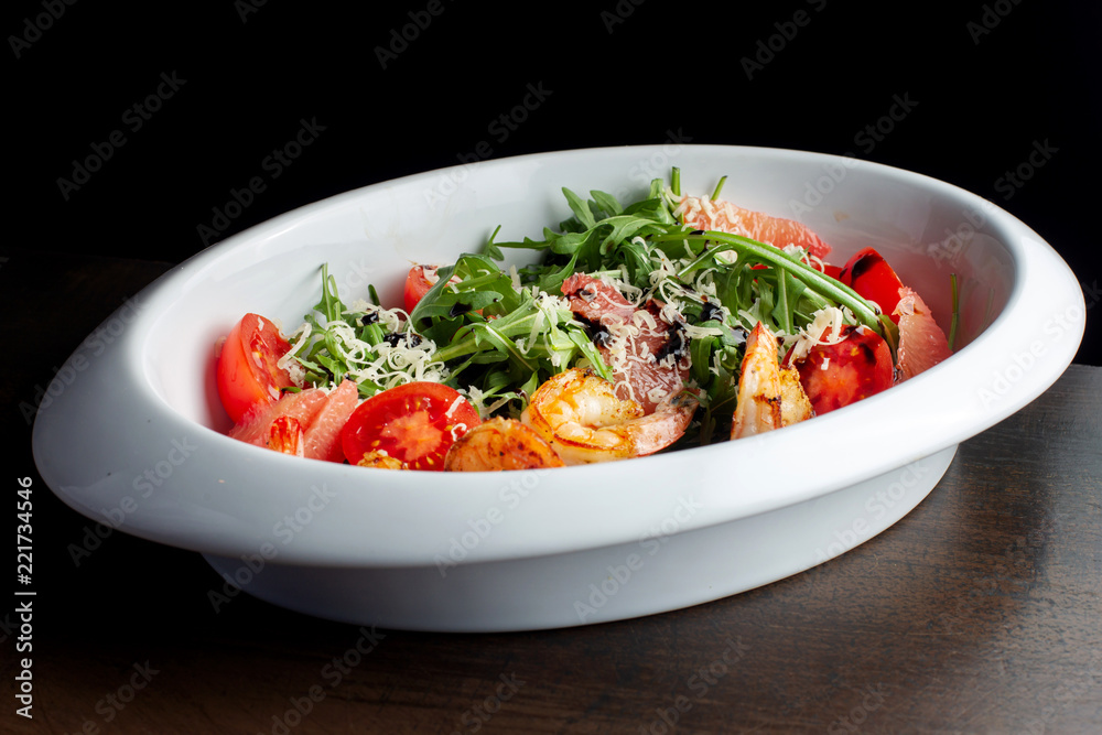 Fresh salad plate with shrimp, tomato and mixed greens. Fresh salad plate with shrimp, tomato and mixed greens.