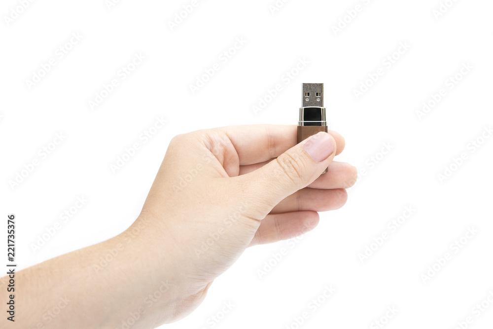 flash drive in woman's hand on white background. Female's hand holding flash drive. flash drive in woman's hand on white background. Female's hand holding flash drive.