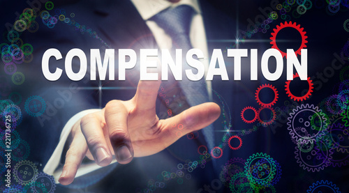 Schilderij op canvas A businessman pressing a Compensation business concept on a graphical display of
