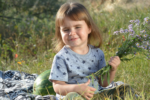 little girl with wildflowers