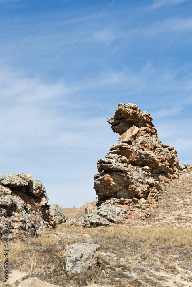 The stone like human of profile in Tazheranskie steppes in Irkutskaya oblast near Baikal lake