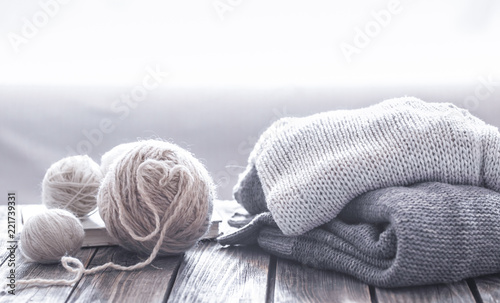 home hobbies, cozy knitted sweaters, wooden background