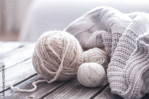 home hobbies, cozy knitted sweaters, wooden background
