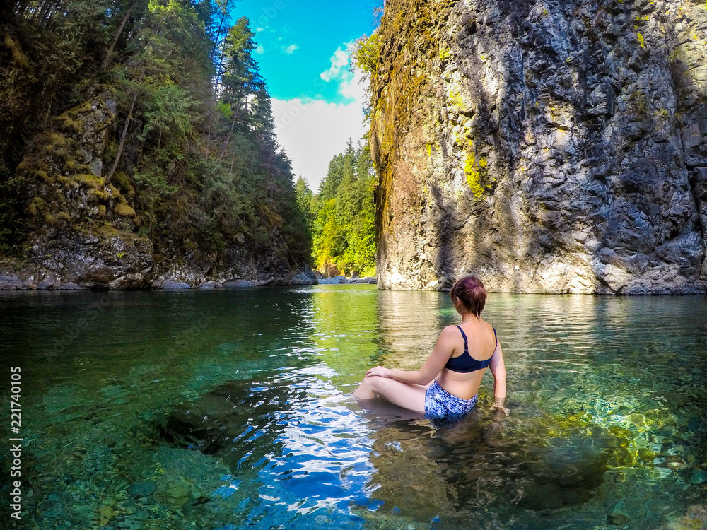 Young Beautiful Woman Swims in Crystal Clear Green River Mermaid Young Beautiful Woman Swims in Crystal Clear Green River Mermaid