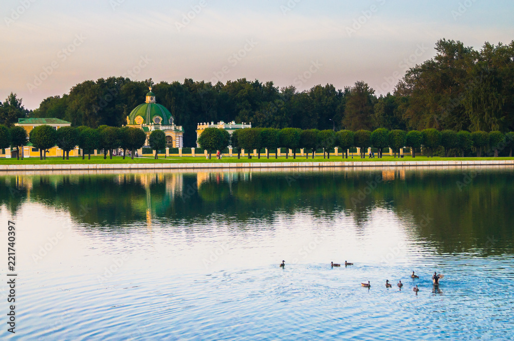 Evening serenity. Fragment of the State reserve museum Kuskovo with palace pond, former aristocratic summer country estate of the russian nobility of the 18th century. Moscow. Russia.