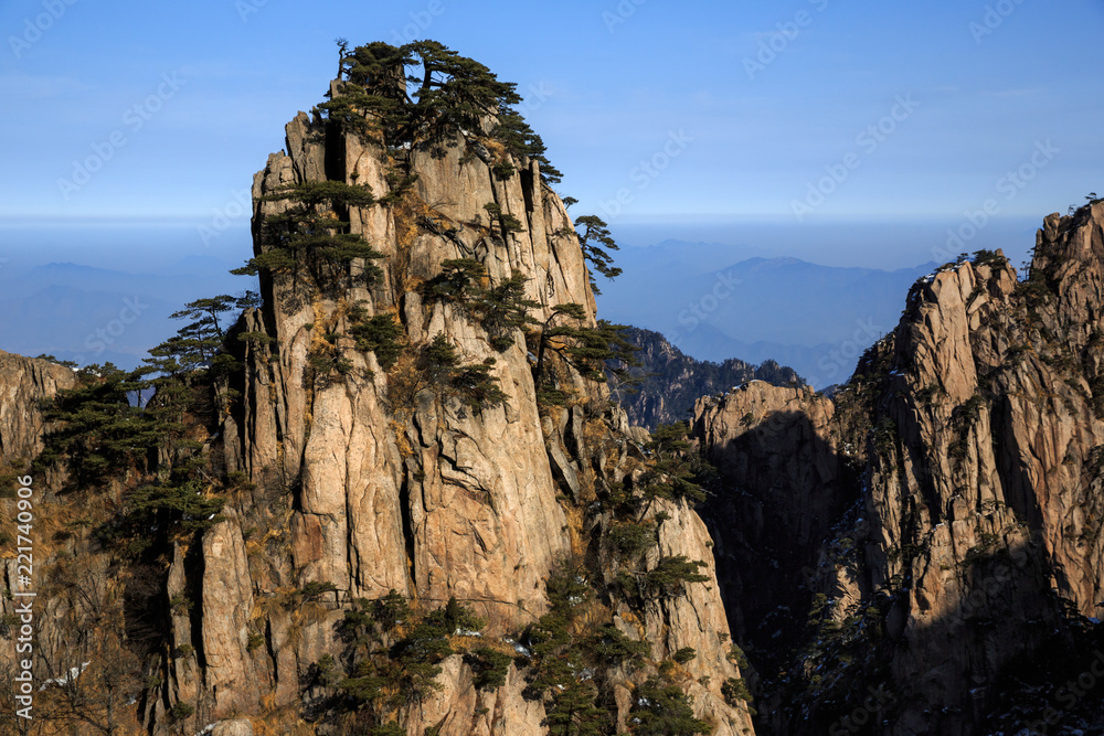 Huangshan China National Park - Anhui Province, Chinese Mountain Peak. Sea of Fog, Yellow Granite Mountains with Canyon, Exotic Pine Trees and Forest, Jagged Cliffs, UNESCO World Heritage Site