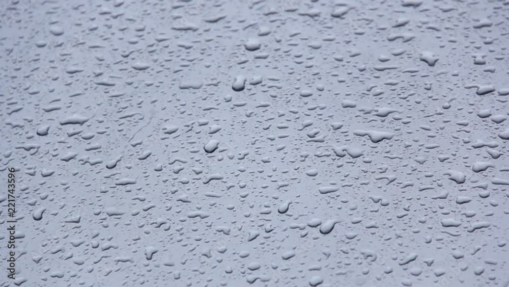 Rainstorm in the Summer Storm Rain and Water Drops on the Metal Surface. Abstract Background. Rainstorm in the Summer Storm Rain and Water Drops on the Metal Surface. Abstract Background.