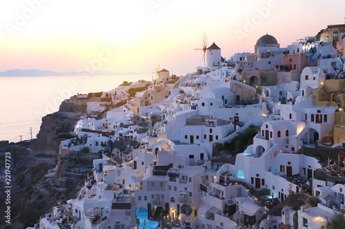 Fabulous picturesque village of Oia in Santorini island at sunset, Greece