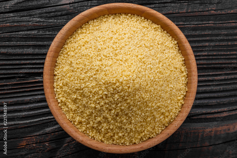 fresh couscous on a wooden rustic background fresh couscous on a wooden rustic background