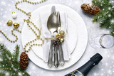 Christmas table place setting on a light slate,stone or concrete backdrop.Christmas holiday background.Top view.