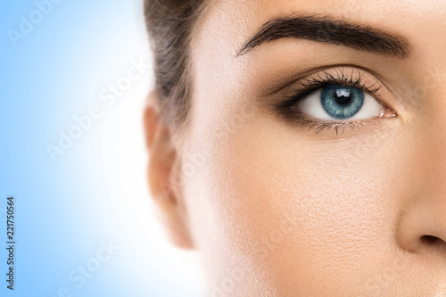 Close-up of female face on blue background