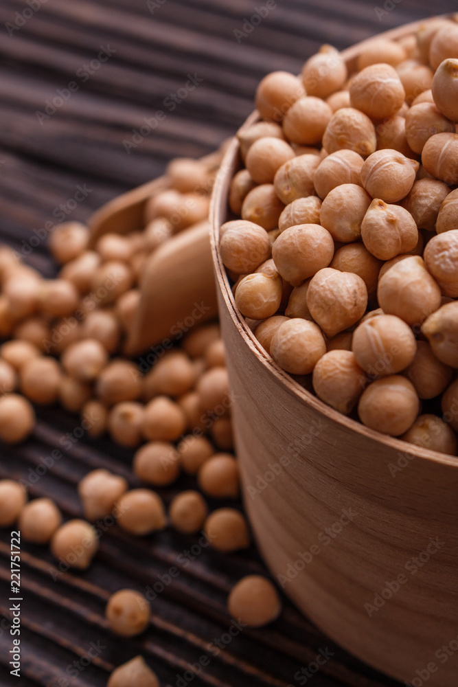 uncooked chickpeas on a wooden rustic background uncooked chickpeas on a wooden rustic background