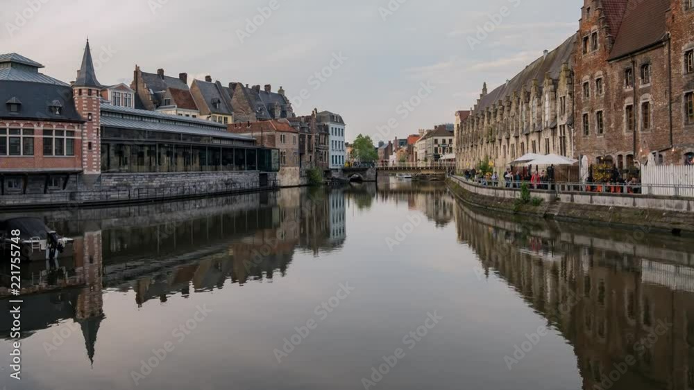 Pan motion timelapse video of the beautiful cityscape and Leie river from afternoon to sunset at Ghent, Belgium Pan motion timelapse video of the beautiful cityscape and Leie river from afternoon to sunset at Ghent, Belgium