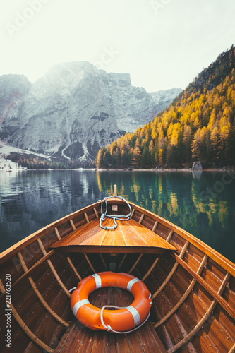 Fototapeta Naklejka Na Ścianę i Meble -  Traditional rowing boat on a lake in the Alps in fall