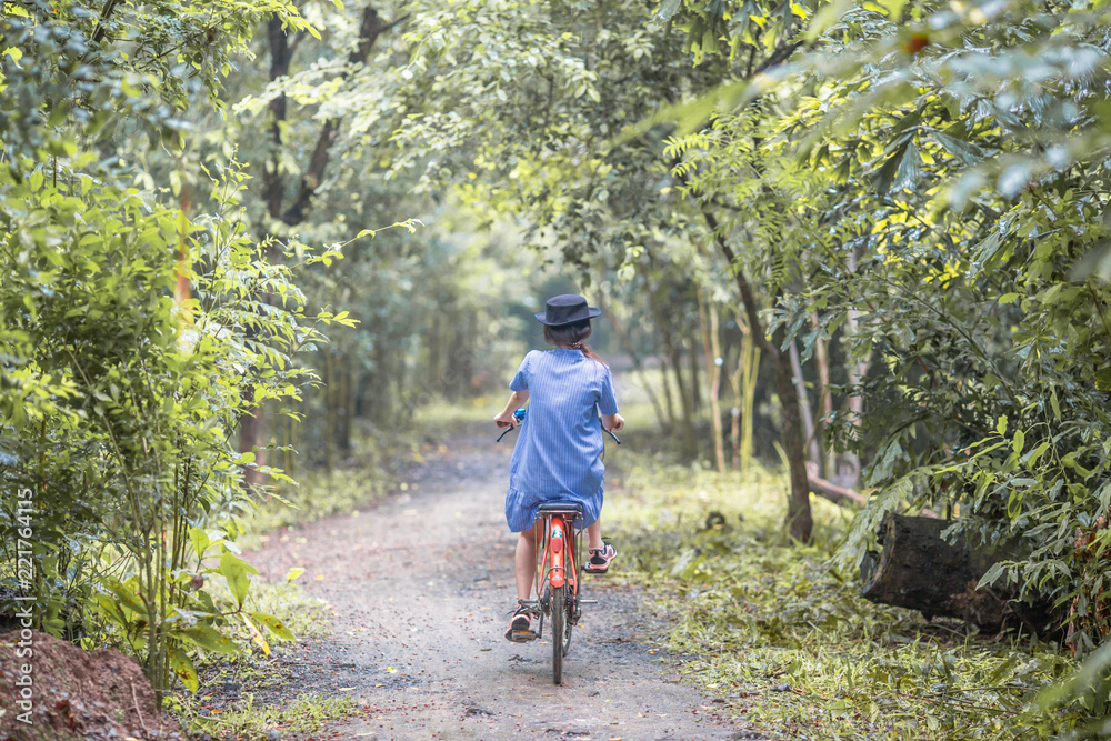 Bangkok: 26 August 2018, female tourists Biking in the park (Bang Kachao, Sri Nakhon Khuean Khan Park and Botanical Garden) Thailand Bangkok: 26 August 2018, female tourists Biking in the park (Bang Kachao, Sri Nakhon Khuean Khan Park and Botanical Garden) Thailand