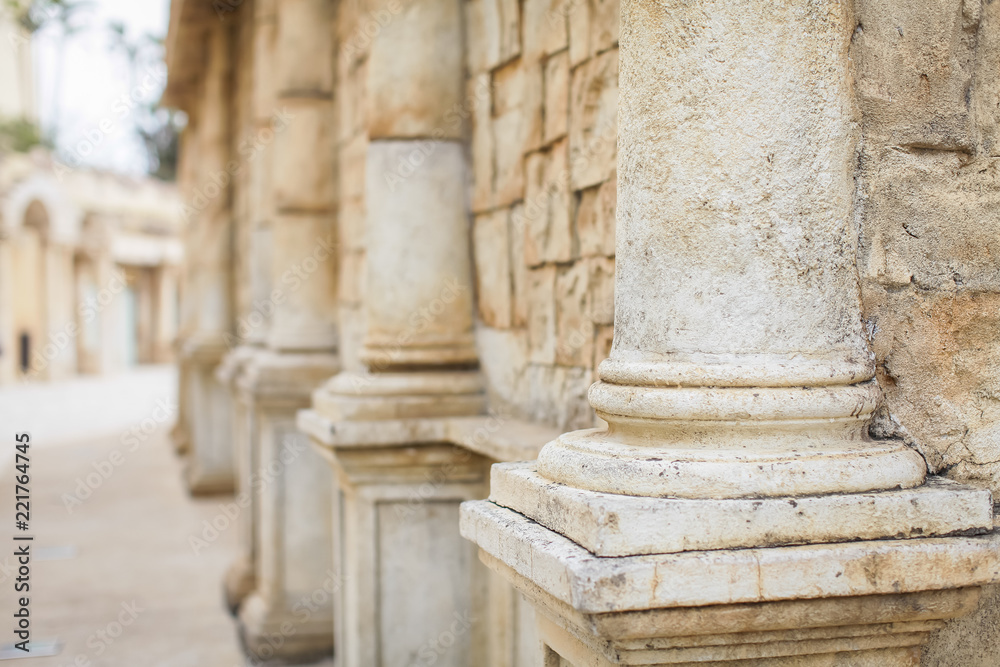 close up row of columns receding into the distance. Pillars in Old Retro Style