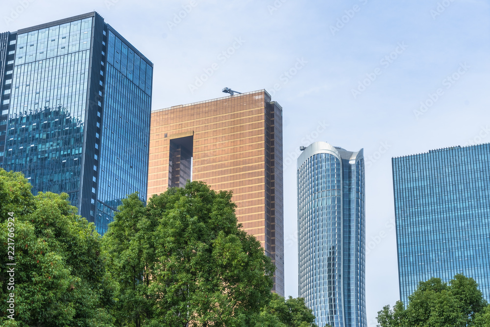 modern office building with green trees.