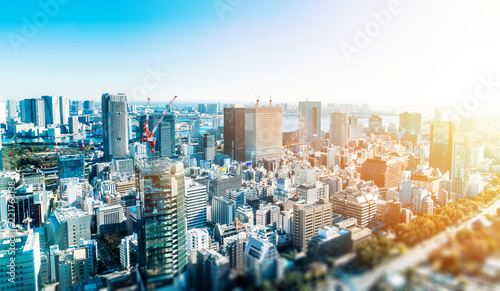 Business and culture concept - panoramic modern city skyline bird eye aerial view under dramatic blue sky in Tokyo, Japan. miniature lens tilt shift blur effect photo