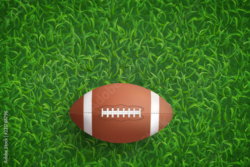 American football ball on green grass texture background. Vector.