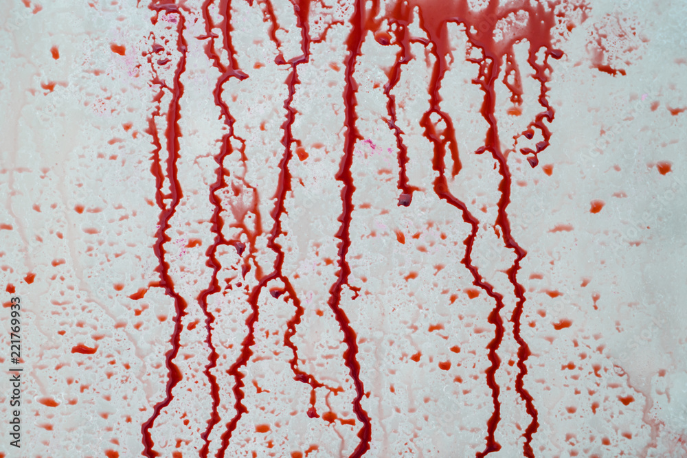 Fototapeta premium Blood liquid splattered on the wall