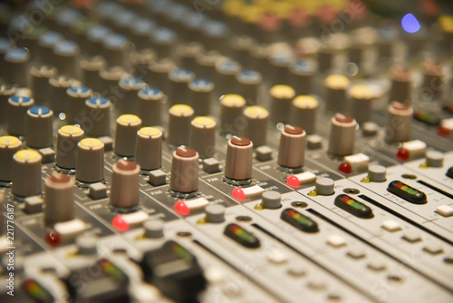 Close up of  digital sound audio mixer and amplifier equipment or music mixer equalizer console. Sound technician audio mixer equalizer control for background. studio music recording concept
