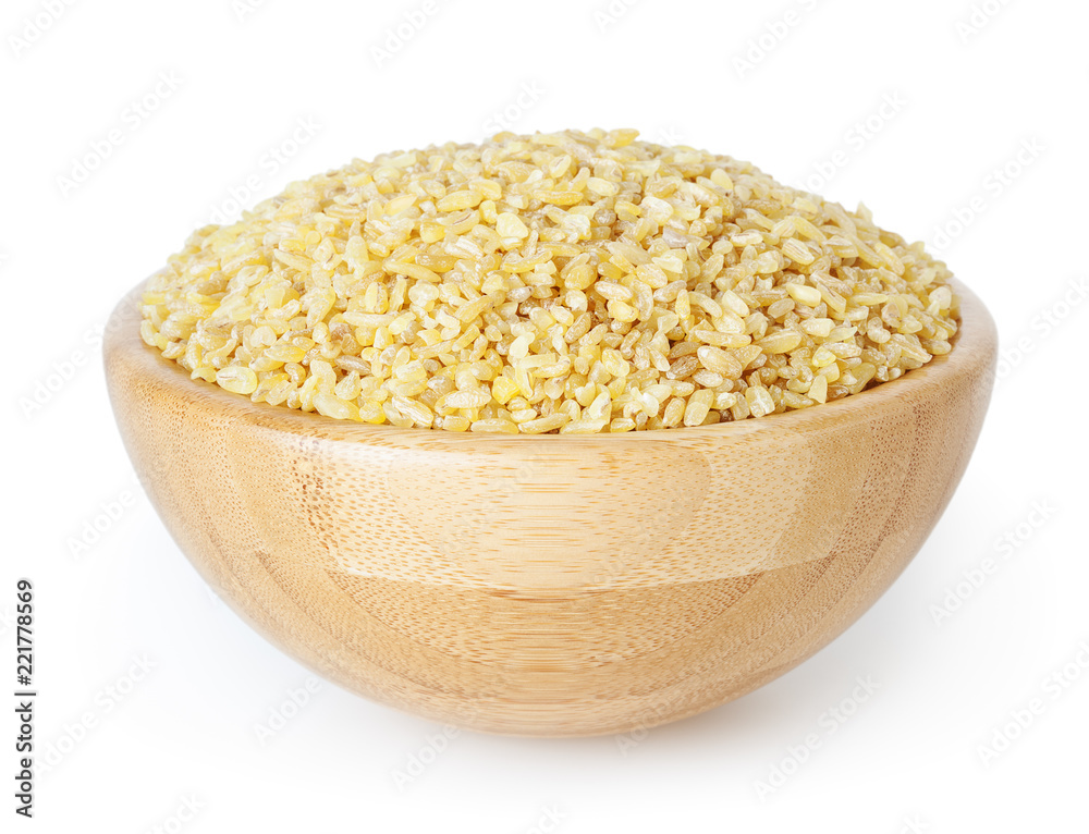 Uncooked bulgur in wooden bowl isolated on white background with clipping path Uncooked bulgur in wooden bowl isolated on white background with clipping path