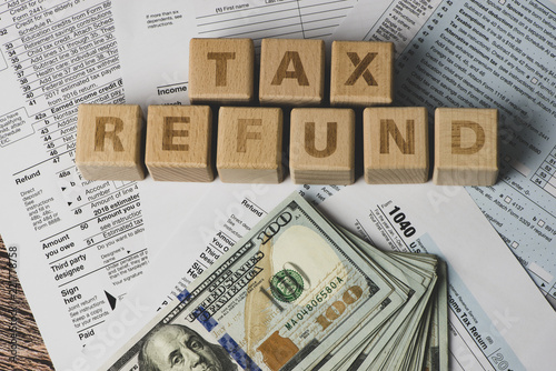 Tax Refund concepts. Tax Refund characters and US currency notes. Tax Return.