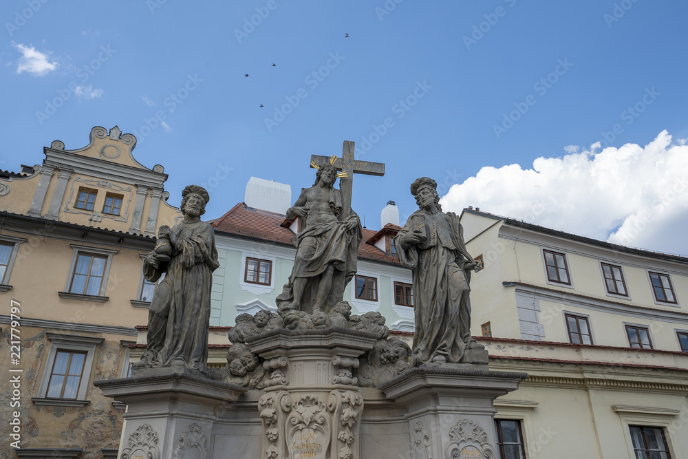 Sculpture of Holy Savior with Cosmas and Damian on the Charles Bridge in Prague. Czech Republic.