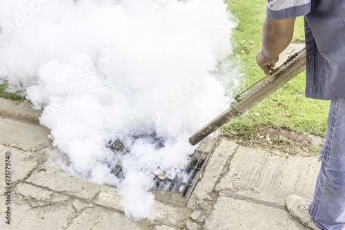 Man are spraying mosquitoes into the drain, Get rid of mosquitoes that cause dengue fever.