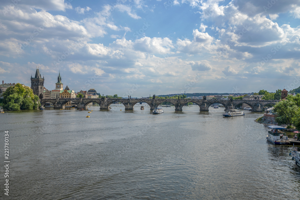 Beautiful summer day, Vltava river, ships and old city center, Prague, Czech Republic. Charles Bridge
