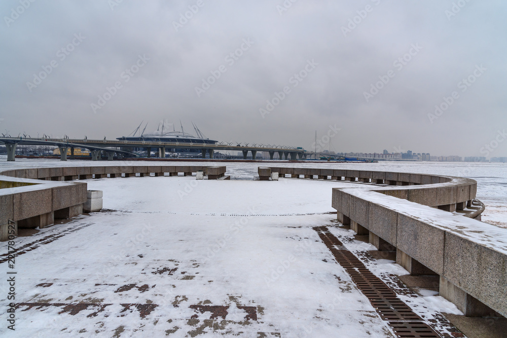View of Stadium Zenith Arena and Western High-Speed Diameter from Park of the 300th anniversary of St. Petersburg in winter. Saint Petersburg, Russia