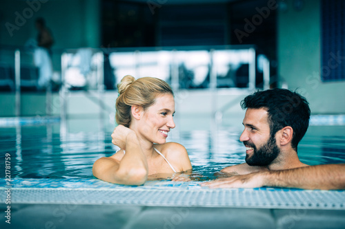 Happy attractive couple relaxing in swimming pool © NDABCREATIVITY