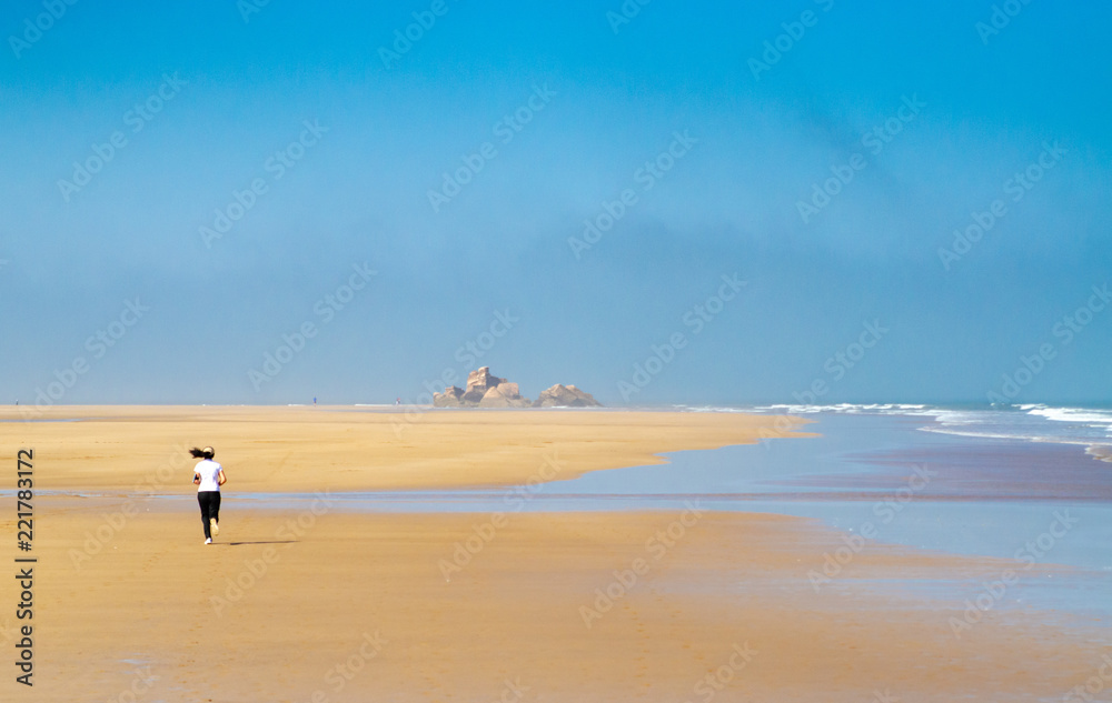 Runner on beach of Essaouira
