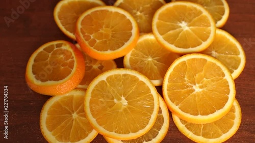 Close-up of juicy ripe sliced orange on a wooden table. Healthy diet. Citrus. Copy space. photo