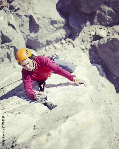 Rock climber on a face of a cliff