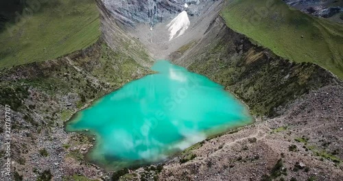 Humantay lake in Peru on Salcantay mountain in the Andes at 5473m altitude, aerial video photo