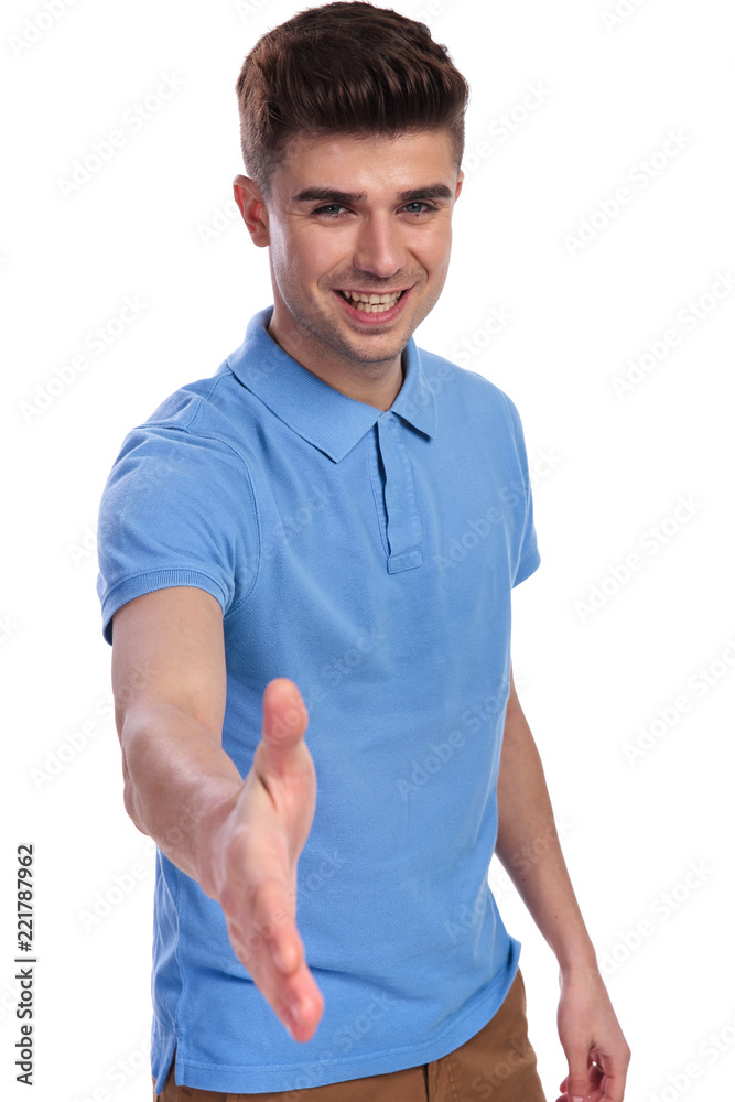 happy casual man welsoming with a handshake happy casual man welsoming with a handshake