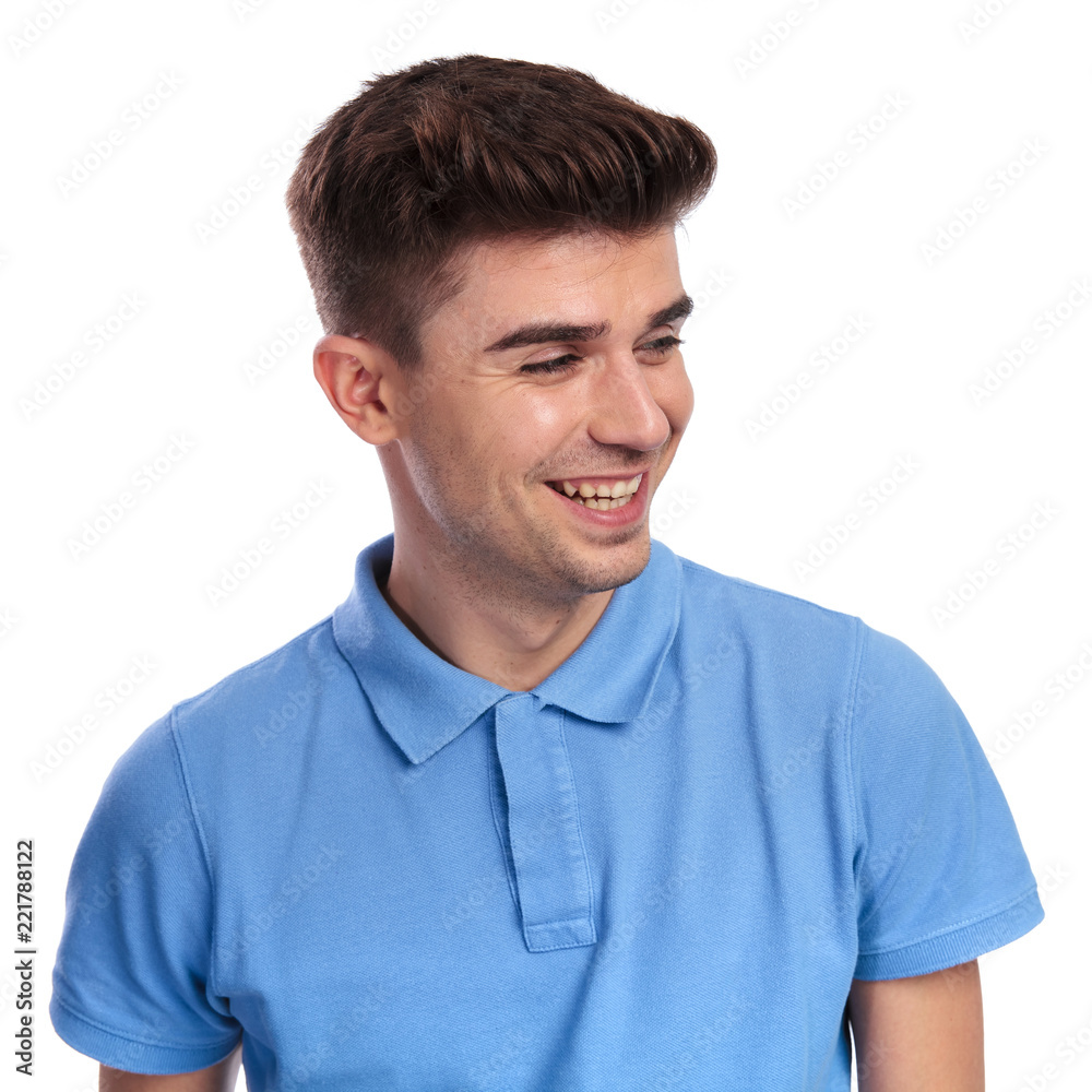 laughing young casual man looks to side laughing young casual man looks to side