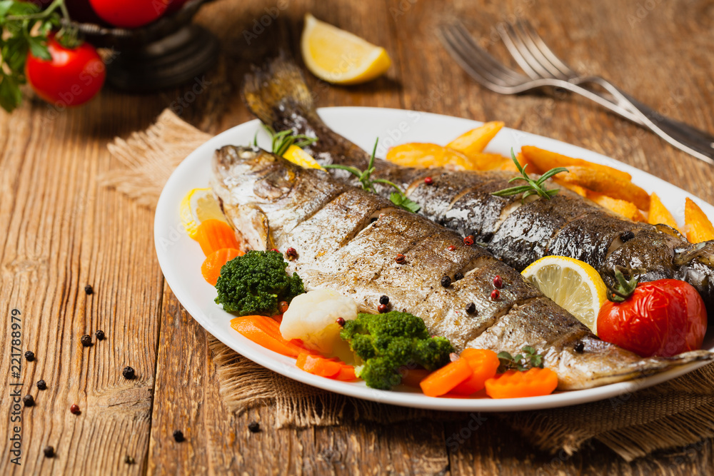 Grilled whole trout. Served with baked potatoes. Grilled whole trout. Served with baked potatoes.