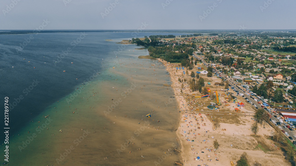Aerial view of the beach. Transparent lake. People are sunbathing. Summer. Ukraine. Aerial view of the beach. Transparent lake. People are sunbathing. Summer. Ukraine.