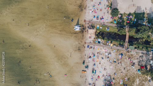 Aerial view of the beach. Transparent lake. People are sunbathing. Summer. Ukraine.