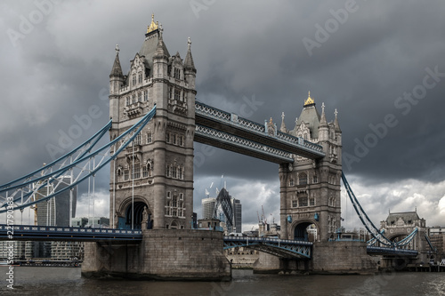 Tower bridge, over the river Thames, London, on a cloudy, stormy day 