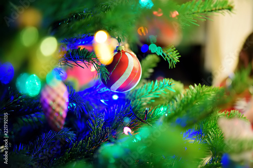 Christmas baubles on christmas tree on lights background