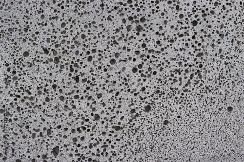 dark gray foam concrete close-up, texture, background, material with copy space.