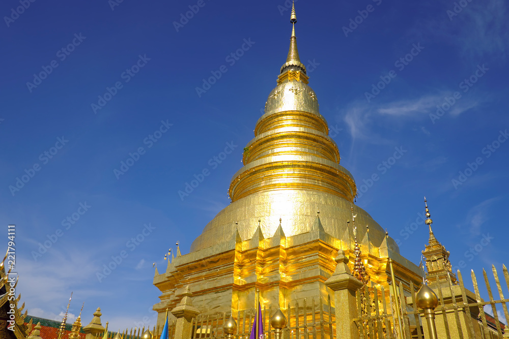 Fototapeta premium Golden pagoda with beautiful blue sky and respected people.