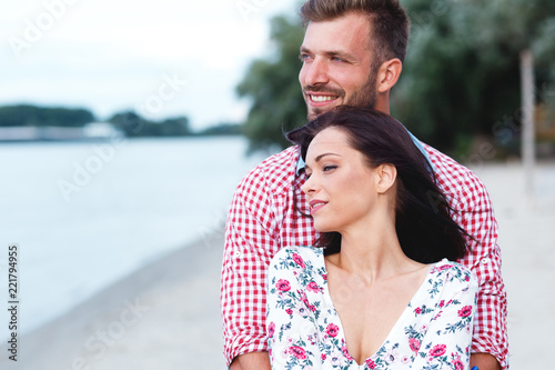 Portrait of young couple in love at beach.